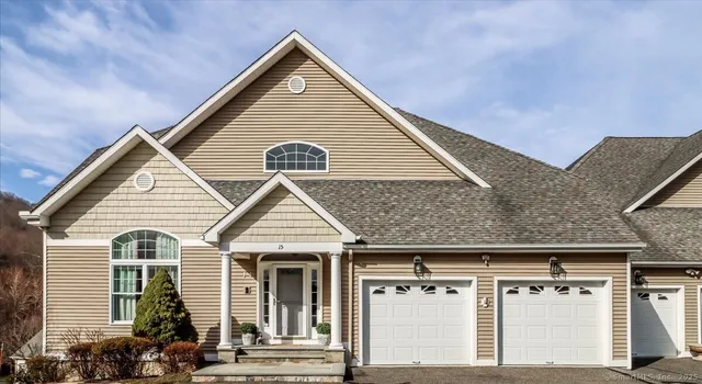 a view of a house with a garage