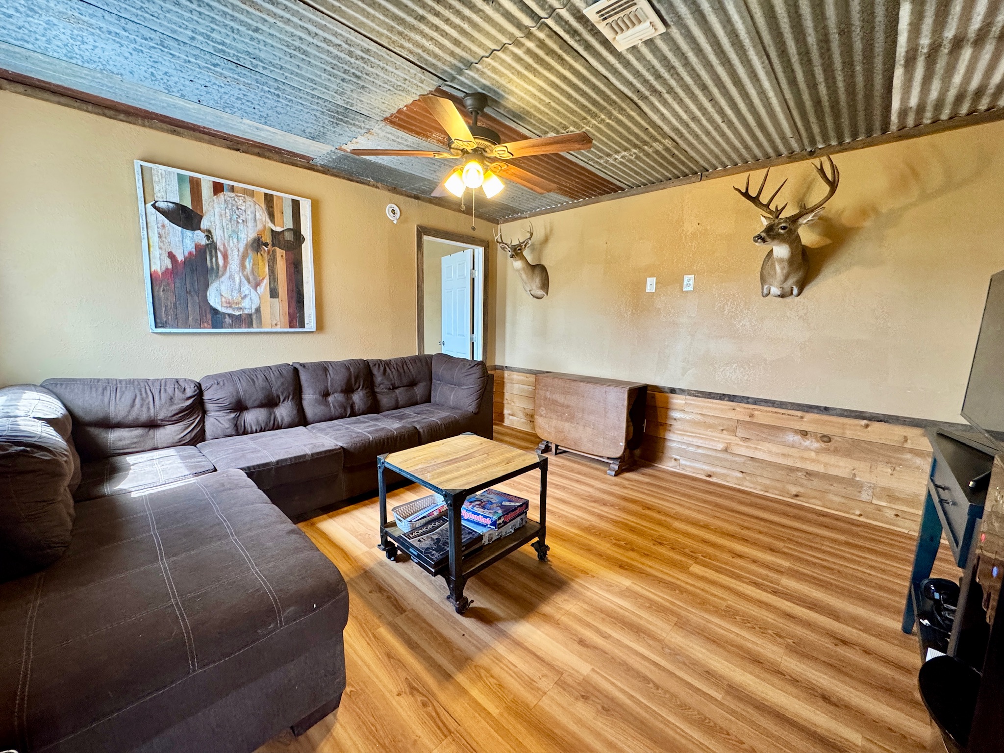9 North Hcr 624 Road Hamilton, TX 76531 - Photo 19 of 40 a living room with furniture and wooden floor