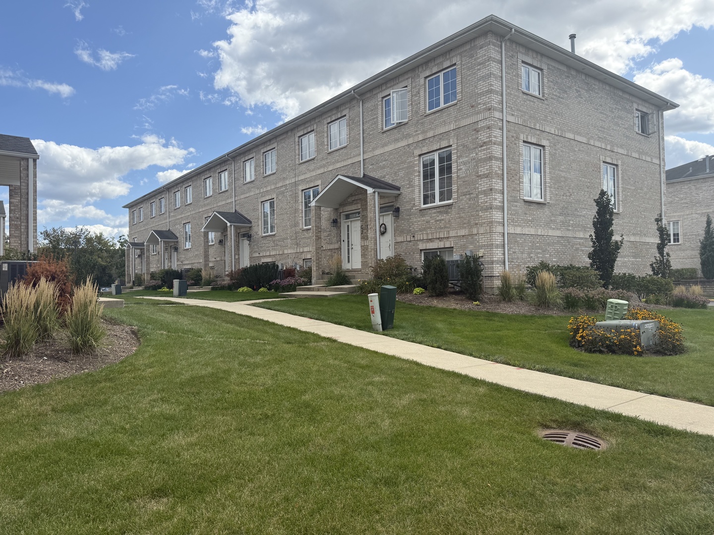 183 East River Road, Unit C1 Des Plaines, IL 60016 - Photo 21 of 25 a front view of a house with a yard