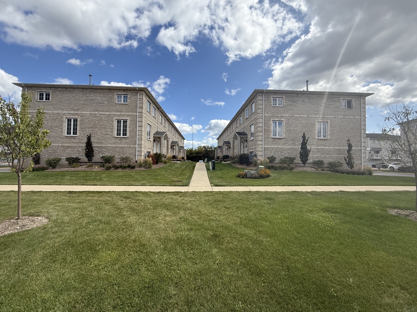 183 East River Road, Unit C1 Des Plaines, IL 60016 - Photo 23 of 25 a view of a house with a big yard