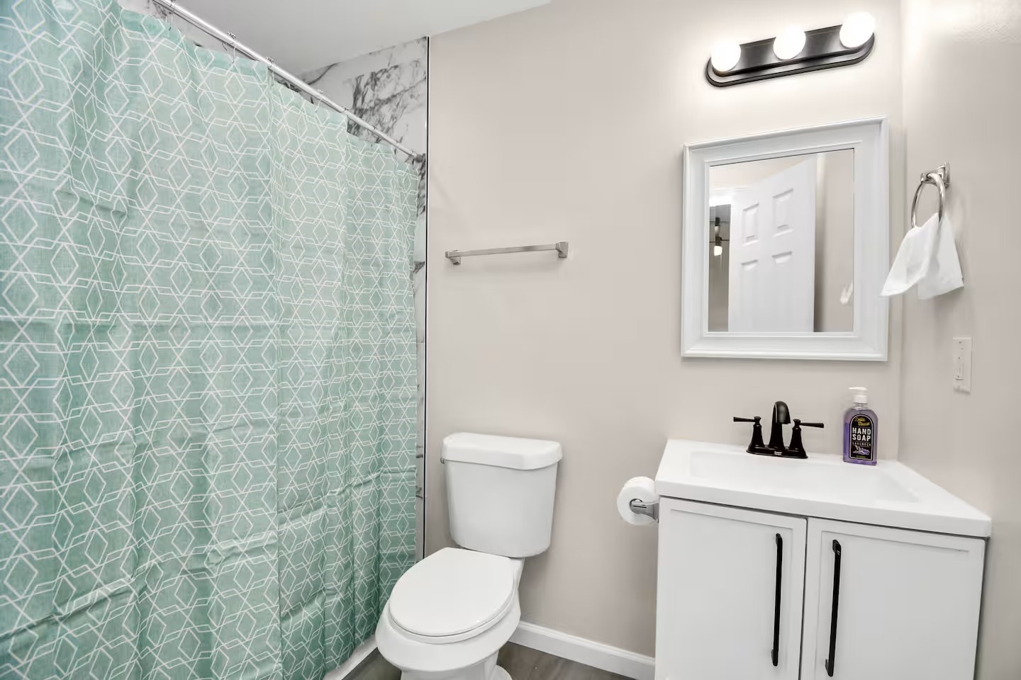 3318 Wichita Street Houston, TX 77004 - Photo 27 of 36 a bathroom with a toilet a sink and a shower