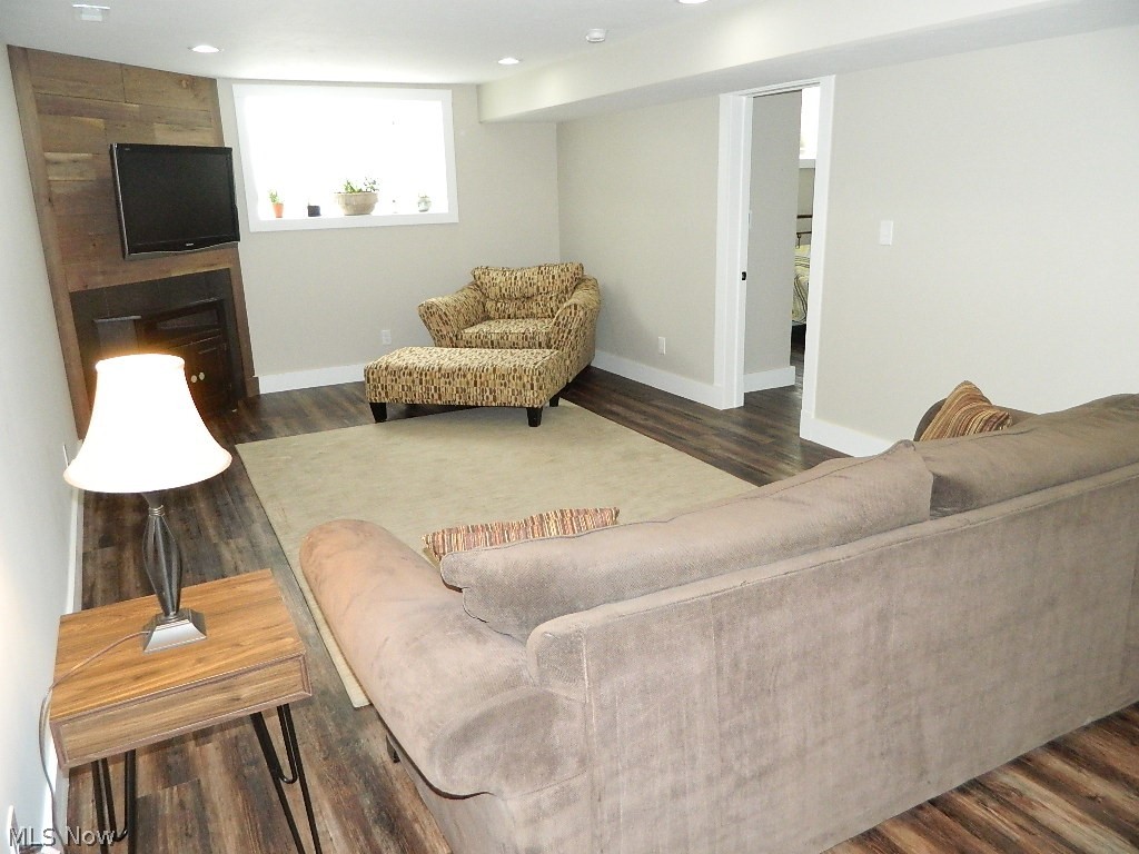 12464 Hotchkiss Road Burton, OH 44021 - Photo 25 of 35 Lower Level Family Room with Full Egress Windows. Flooring in this Level is Vinyl Plank and the Flooring is Heated! This Room has Plumbing Installed if You Wanted to Add a Kitchennette!