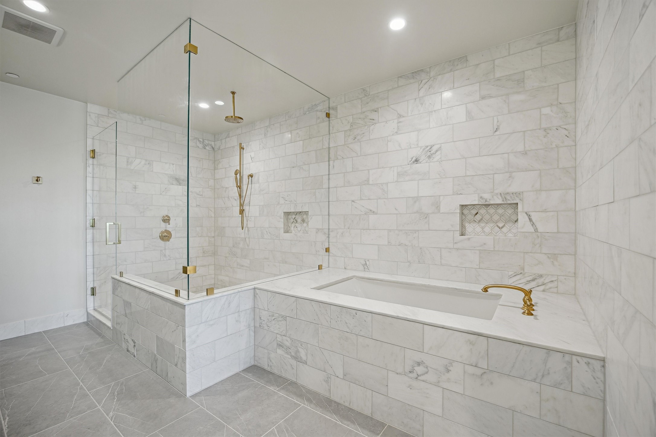 1717 Bissonnet Street, Unit 1802 Houston, TX 77005 - Photo 20 of 46 Seamless marble slab tub surround with floor to ceiling marble tile.