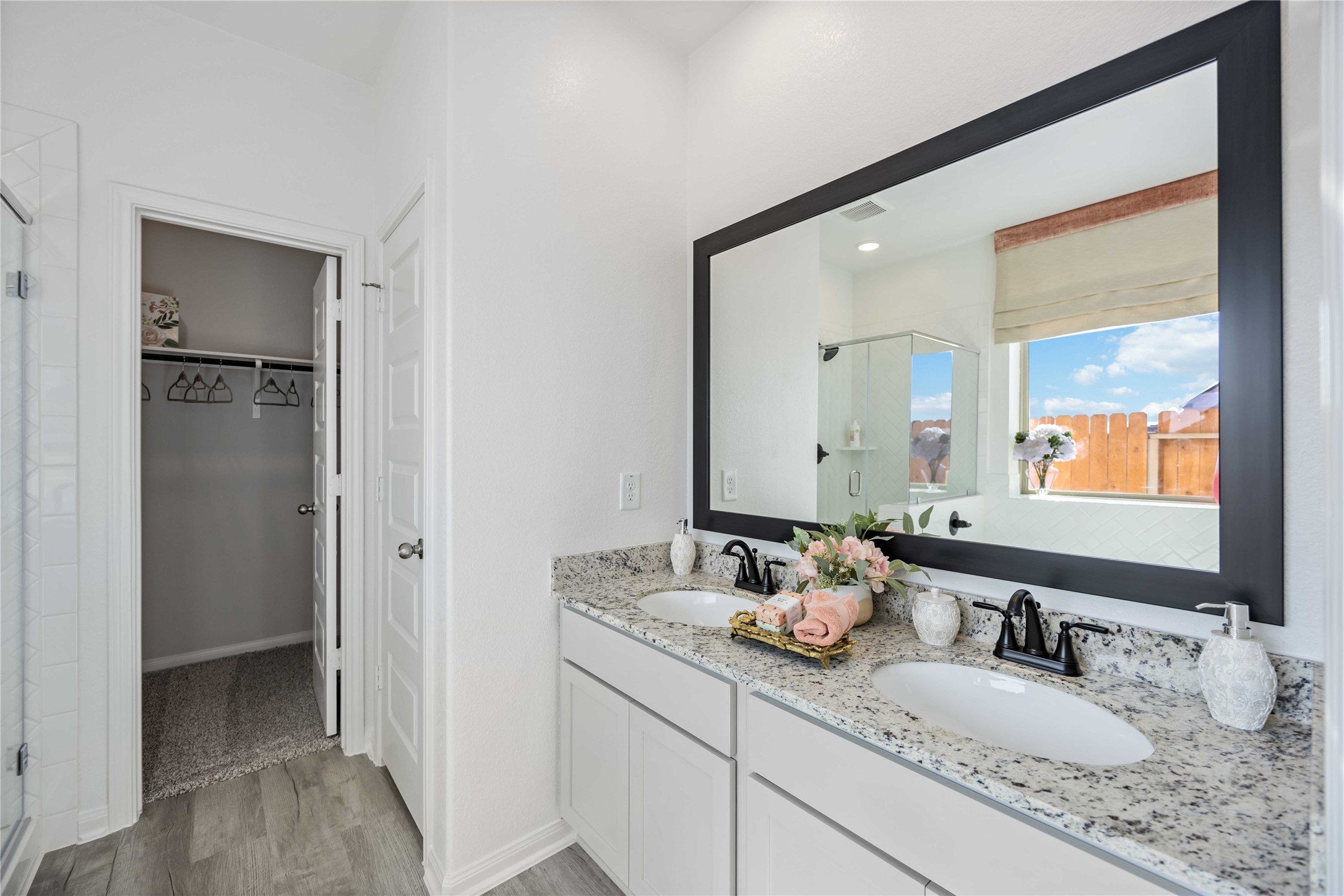 22470 Kinley Street New Caney, TX 77357 - Photo 14 of 21 a bathroom with double vanity sink and two mirror