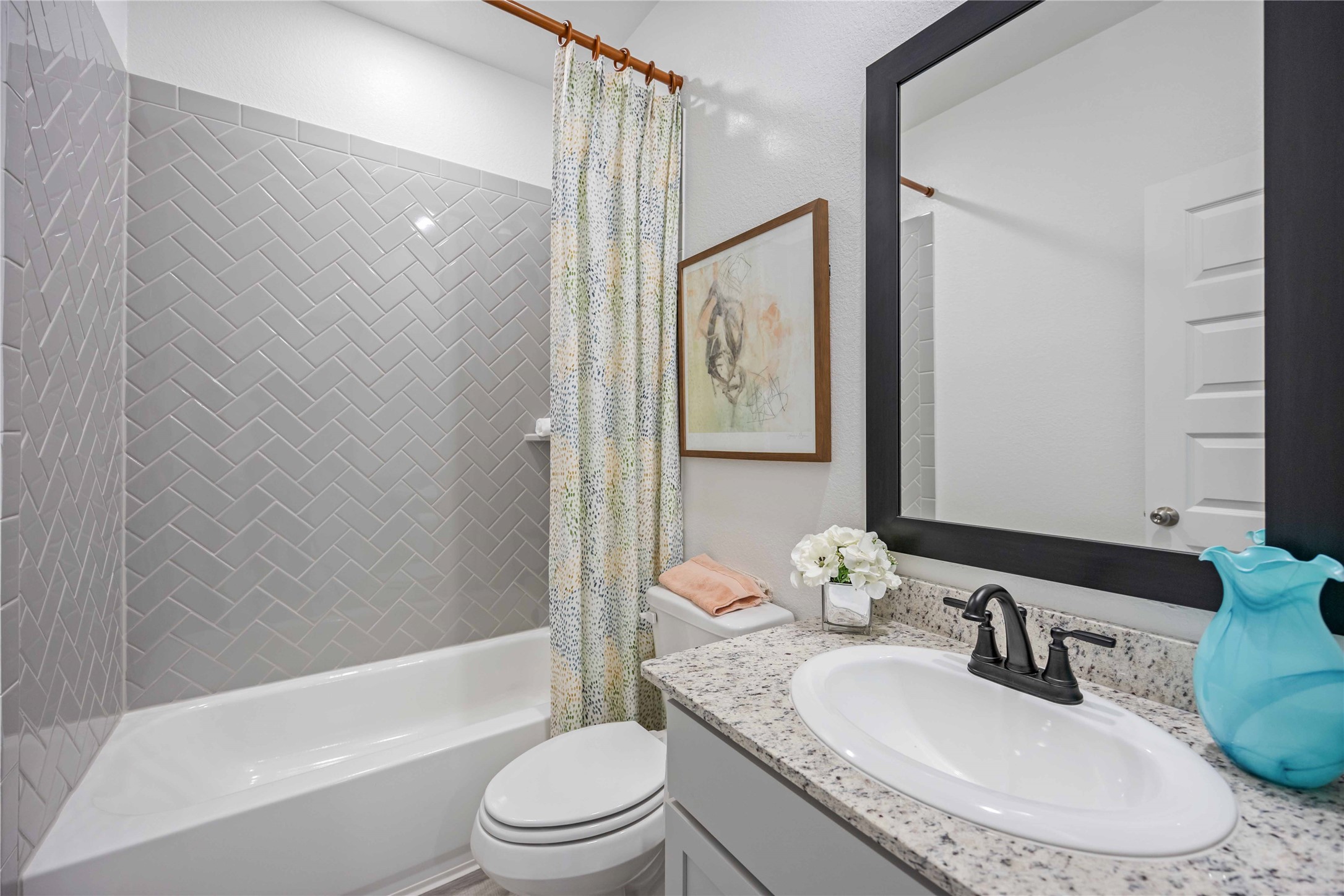 22470 Kinley Street New Caney, TX 77357 - Photo 20 of 21 a bathroom with a granite countertop sink toilet and shower