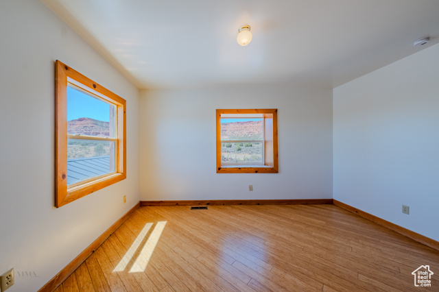 6178 East Zion Road Kanab, UT 84741 - Photo 32 of 48 Empty room with light wood finished floors and baseboards