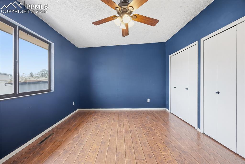 930 Fontmore Road, Unit C Colorado Springs, CO 80904 - Photo 19 of 32 a view of a big room with wooden floor and windows