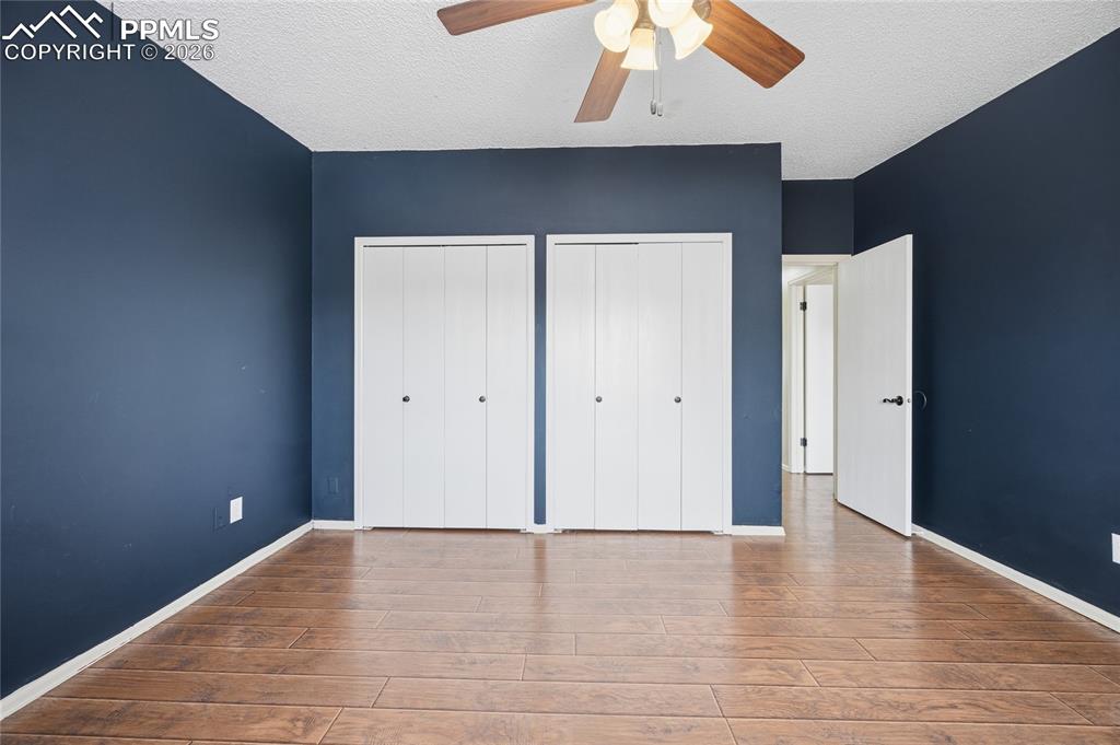 930 Fontmore Road, Unit C Colorado Springs, CO 80904 - Photo 20 of 32 a view of an empty room with wooden floor