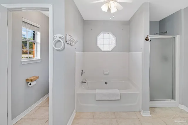 a view of bathroom with dual sinks and mirror
