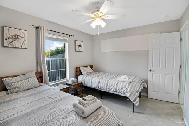 a bedroom with a bed and window