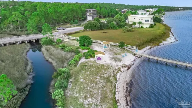 an aerial view of a house with a yard basket ball court and outdoor seating