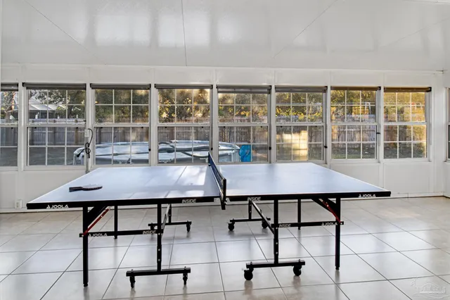 a view of a dining room with furniture and window