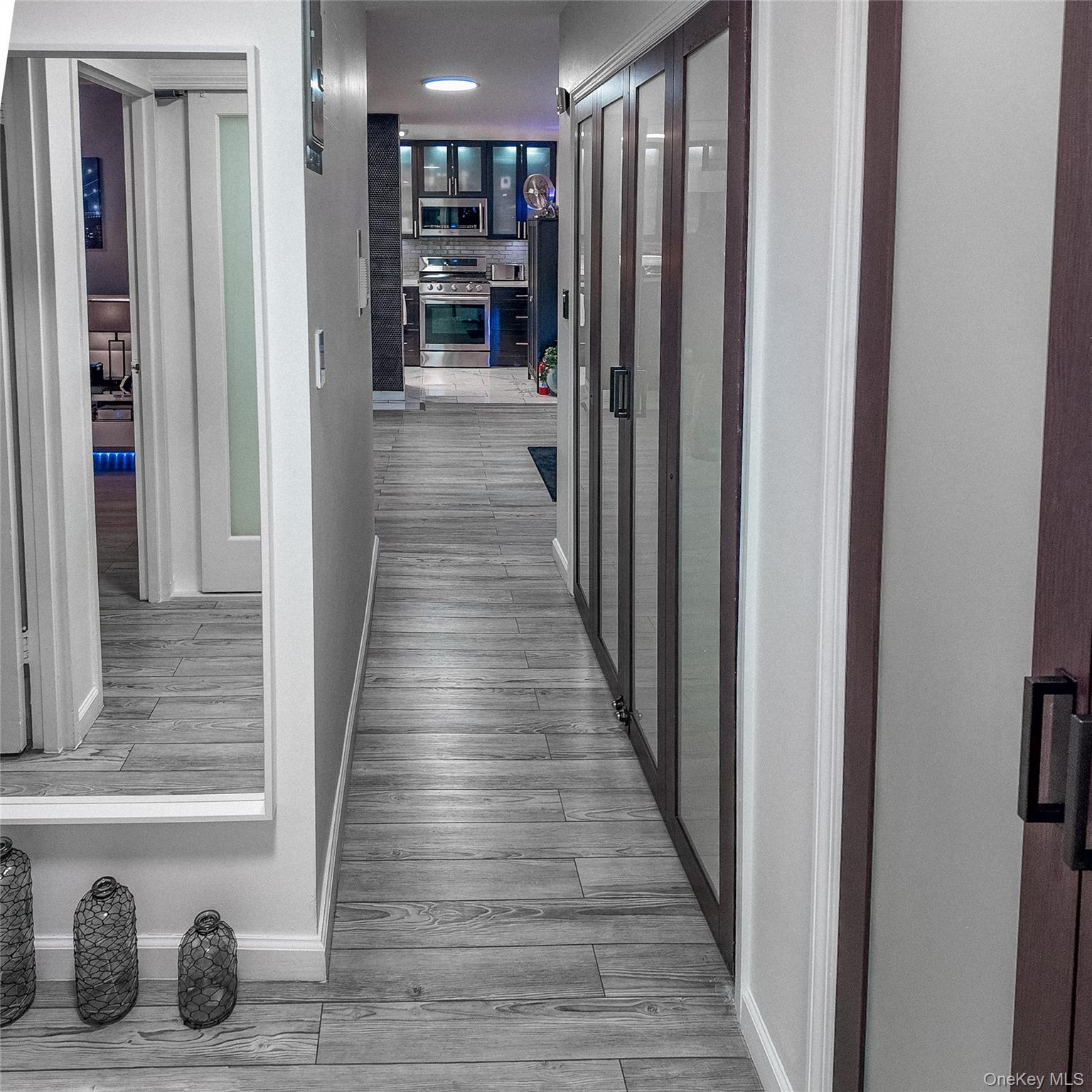 1966 Newbold Avenue, Unit 904 Bronx, NY 10472 - Photo 12 of 15 a view of a hallway with wooden floor and staircase