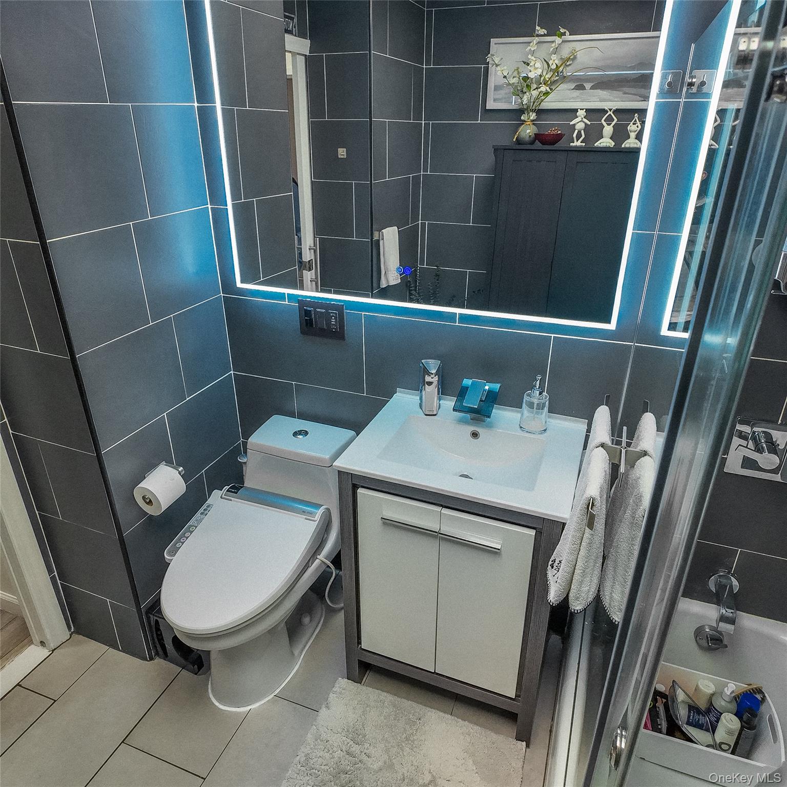 1966 Newbold Avenue, Unit 904 Bronx, NY 10472 - Photo 6 of 15 a bathroom with a sink toilet and shower