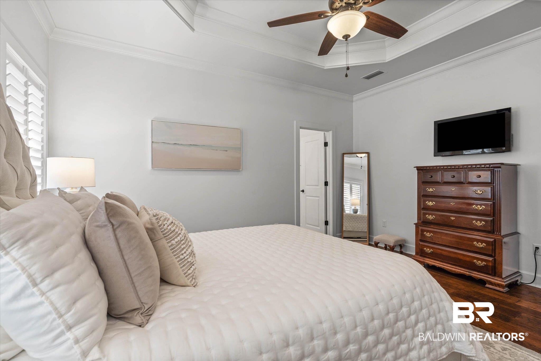 1052 Linlen Avenue Mobile, AL 36609 - Photo 11 of 22 Bedroom featuring dark wood-type flooring, a tray ceiling, ornamental molding, and ceiling fan