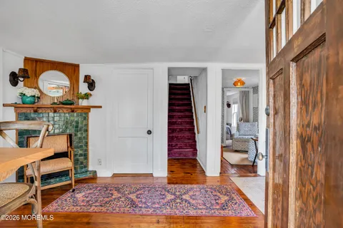 a view of room with furniture and wooden floor