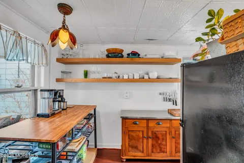 an outdoor living room with furniture and a window