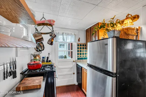 a storage & utility room with two washing machine