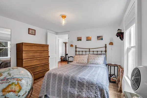 a bedroom with a bed and a closet