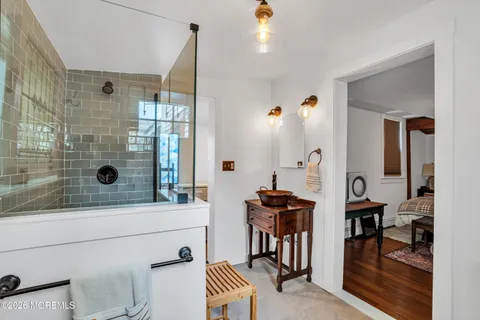 a bathroom with a bathtub and a shower