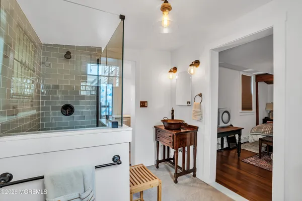 a bathroom with a bathtub and a shower