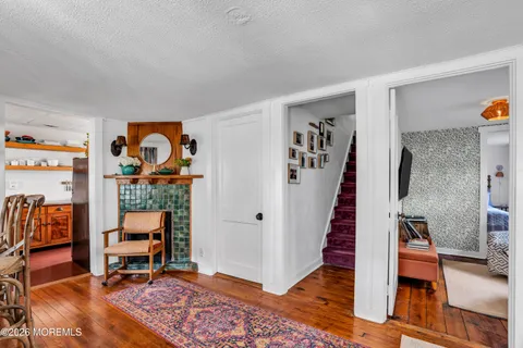 a view of a livingroom with furniture and staircase