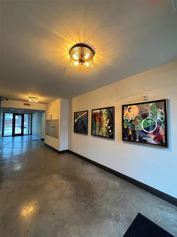 a picture of a bathroom with a shower and a mirror