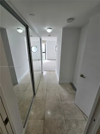 view of room with window and ceiling fan