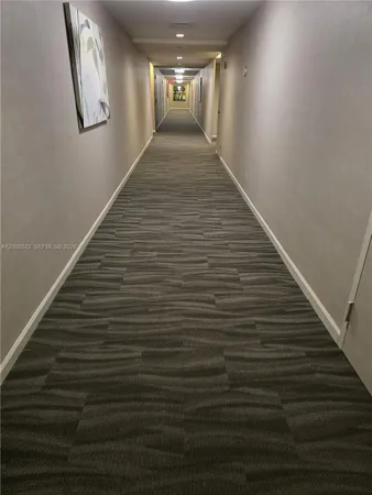 a view of gallery with wooden floor
