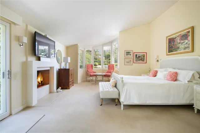 a view of a bathroom with a tub and shower