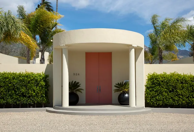 a living room with fireplace furniture and a wooden floor