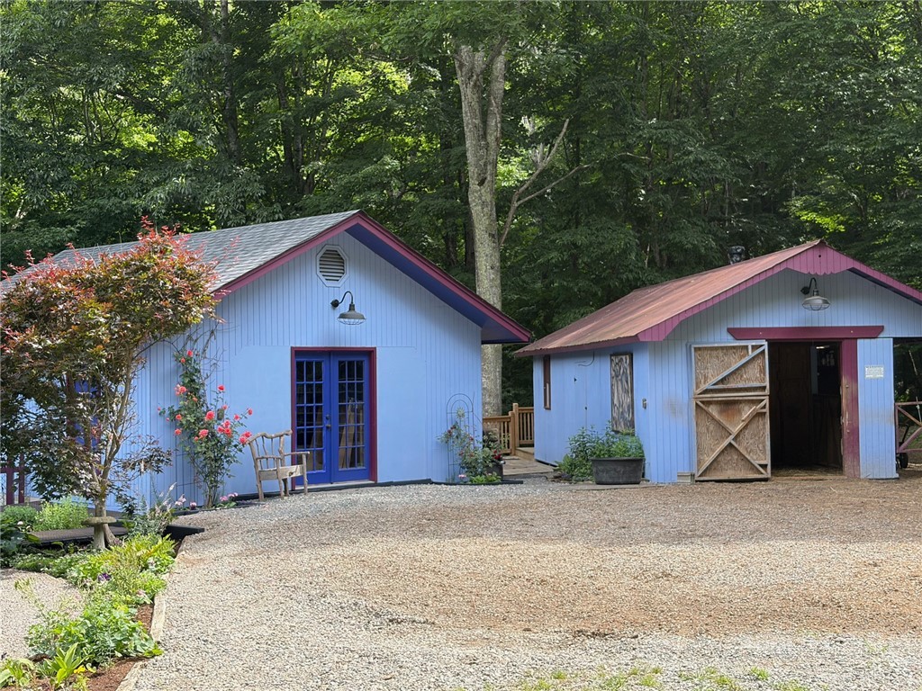 873 Silverleaf Road Zionville, NC 28698 - Photo 5 of 49 a front view of a house with a yard and garage