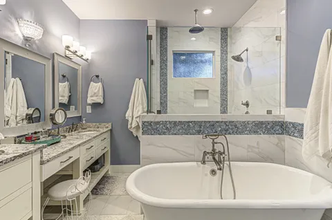 a kitchen with stainless steel appliances a stove a refrigerator and cabinets