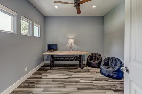 a living room with a couch and wooden floor