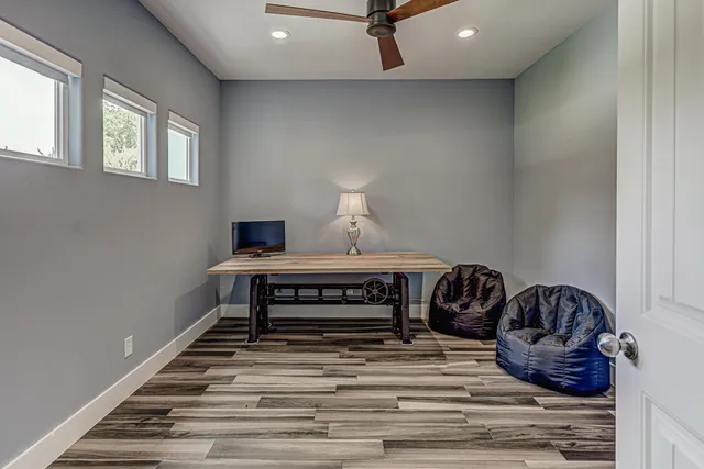 a living room with a couch and wooden floor
