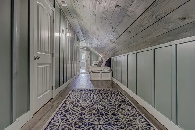 a bedroom with a bed and a view of bathroom