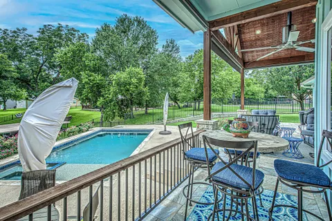 a view of a patio with swimming pool