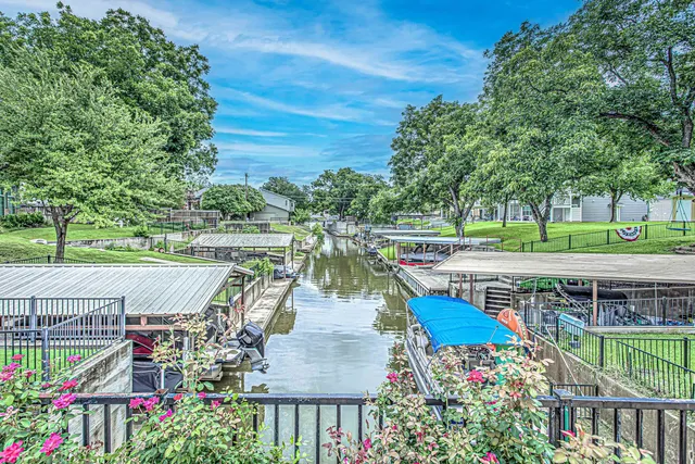a view of house with outdoor seating area and swimming pool