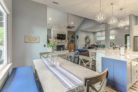 a bedroom with furniture and a large window