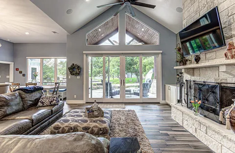 a bedroom with furniture and wooden floor