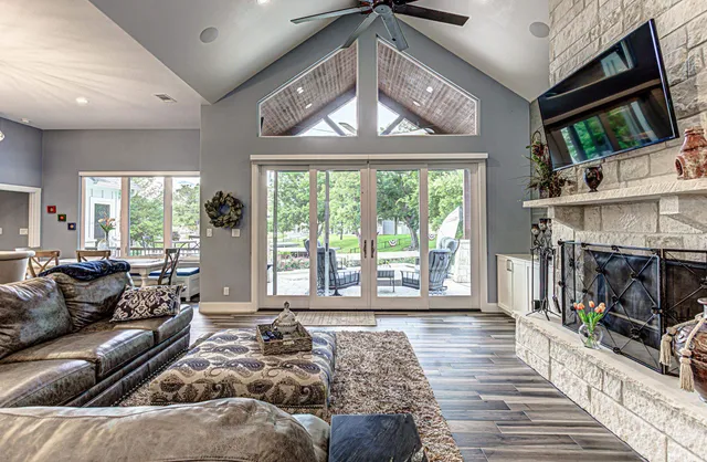 a bedroom with furniture and wooden floor