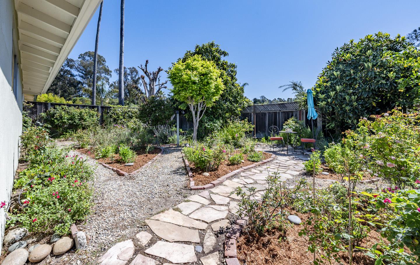 3350 Hardin Way Soquel, CA 95073 - Photo 28 of 45 a backyard of a house with a garden and outdoor seating