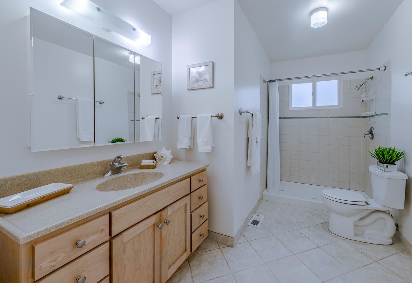 3350 Hardin Way Soquel, CA 95073 - Photo 36 of 45 a bathroom with a granite countertop sink toilet and shower