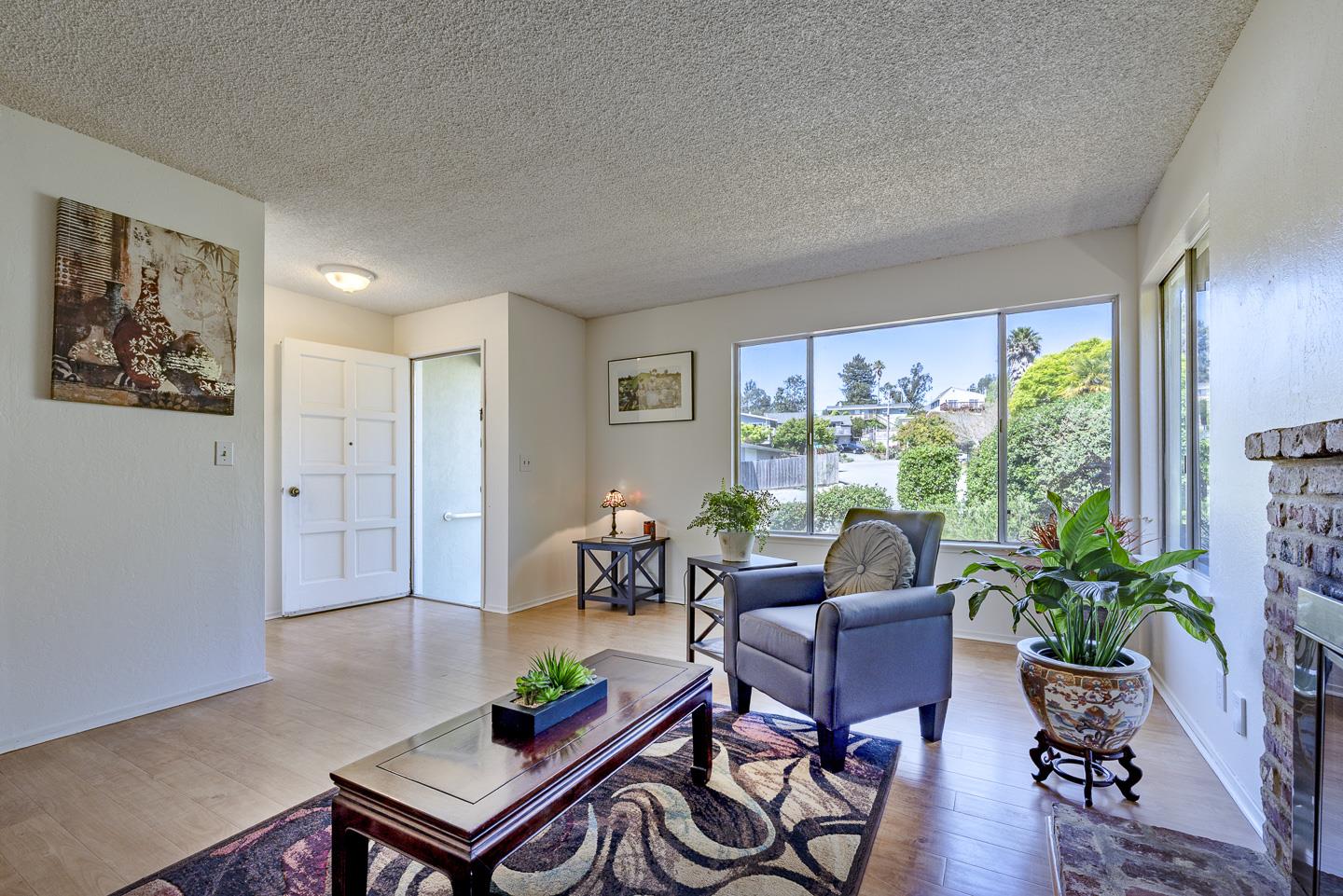 3350 Hardin Way Soquel, CA 95073 - Photo 7 of 45 a living room with furniture potted plant and a large window
