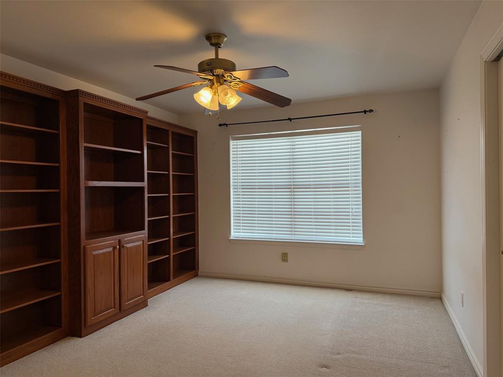 150 Timberidge Lake Road Graham, TX 76450 - Photo 13 of 25 a view of an empty room with a window and a kitchen