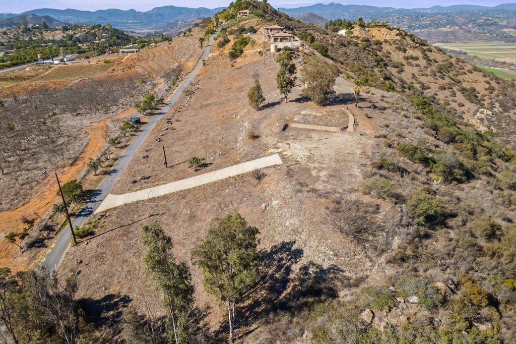 15840 Highland Valley Road Escondido, CA 92025 - Photo 12 of 18 a view of a dry yard with mountains