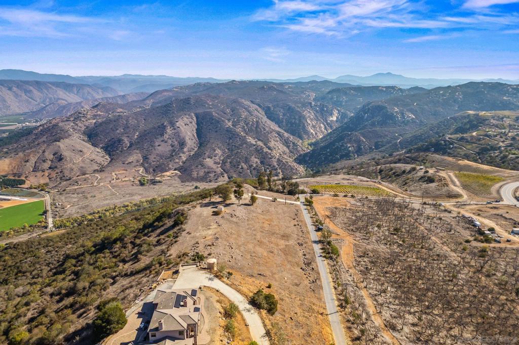 15840 Highland Valley Road Escondido, CA 92025 - Photo 15 of 18 a view of a backyard with wooden fence