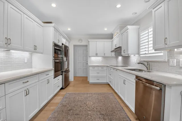 a view of a hallway with paintings on the wall