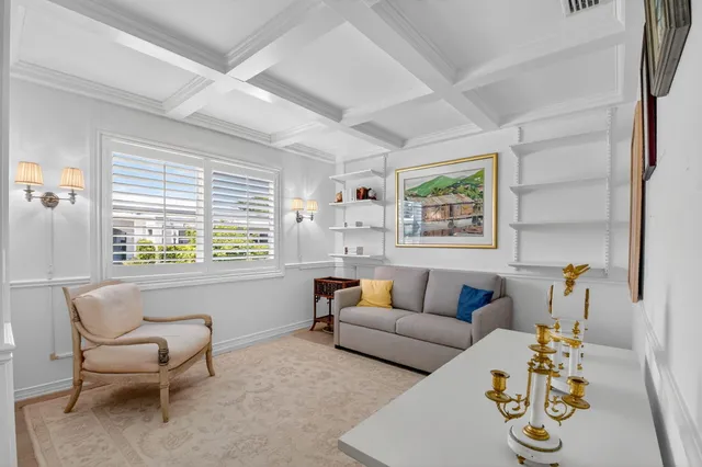 a view of a table and chairs in backyard of the house