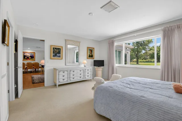 an aerial view of a house with garden space and street view